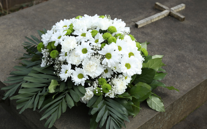 Personalizing the floral arrangement for a man's funeral -